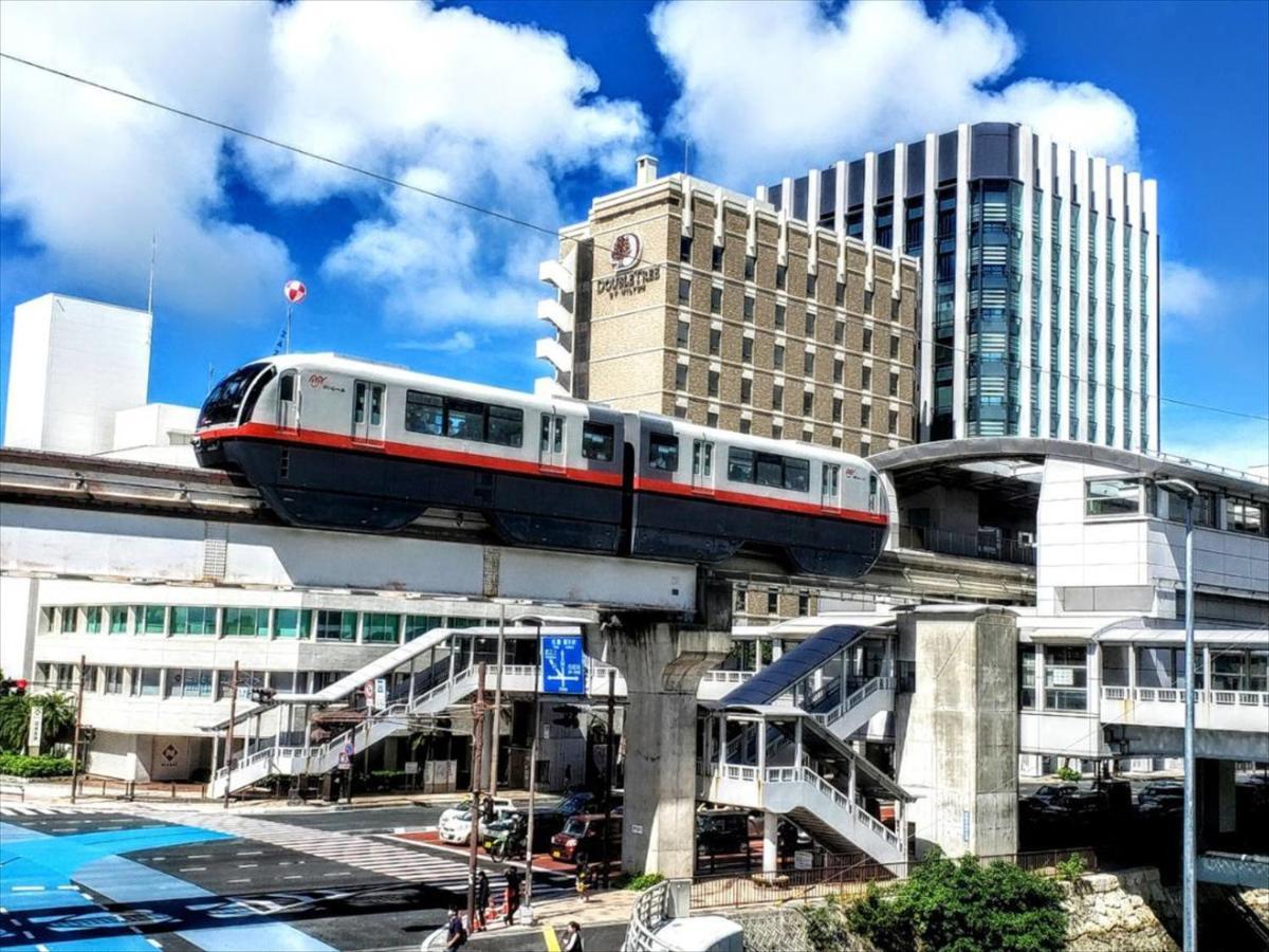 かりゆしコンドミニアムリゾート那覇スカイリビングホテル旭橋駅前 Naha Esterno foto